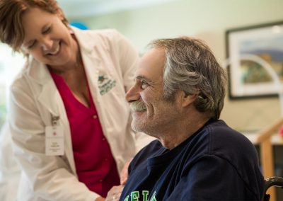 Nurse with patient checking heart rate